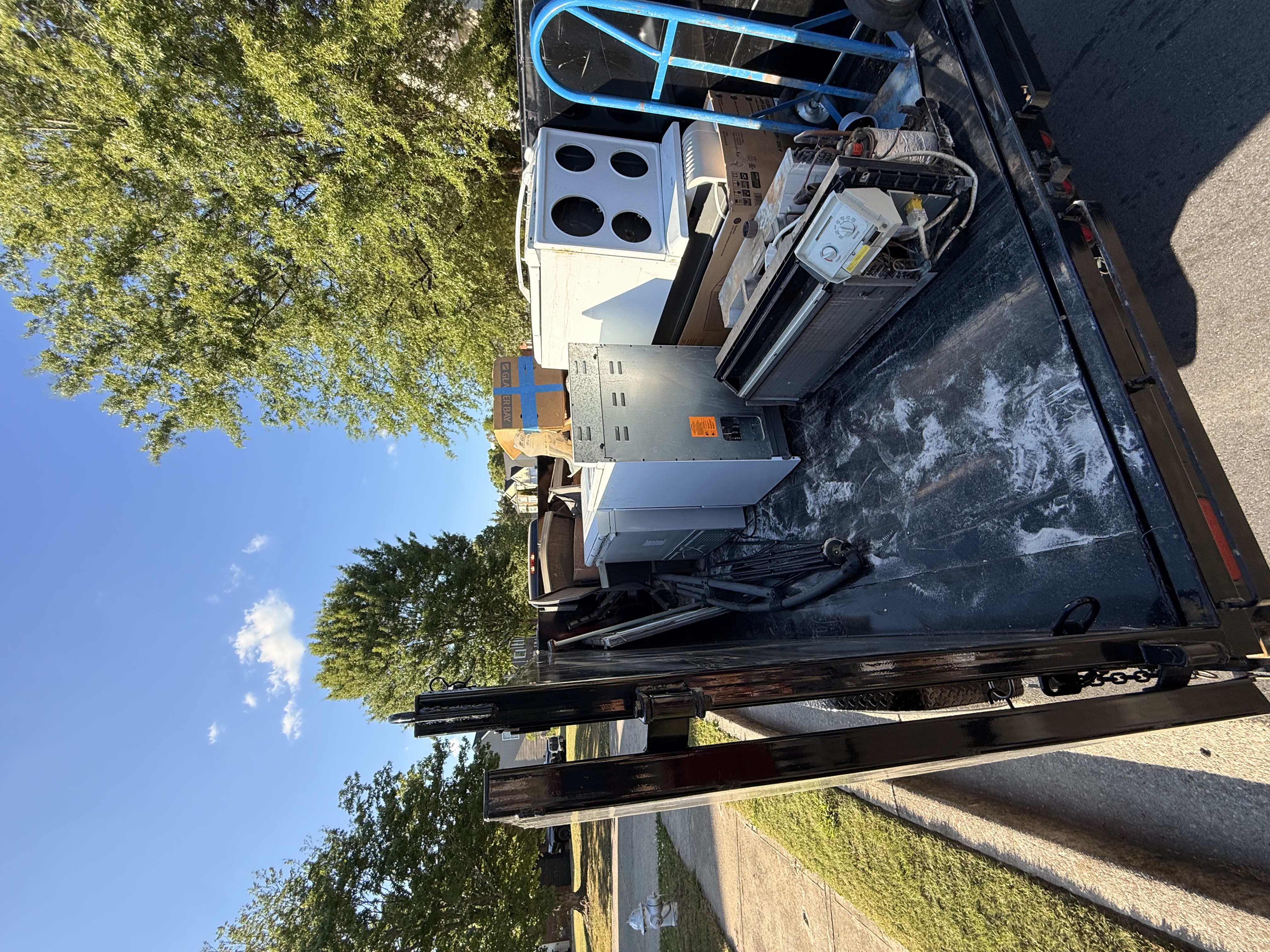 Appliances loaded on REZ Services trailer ready for removal