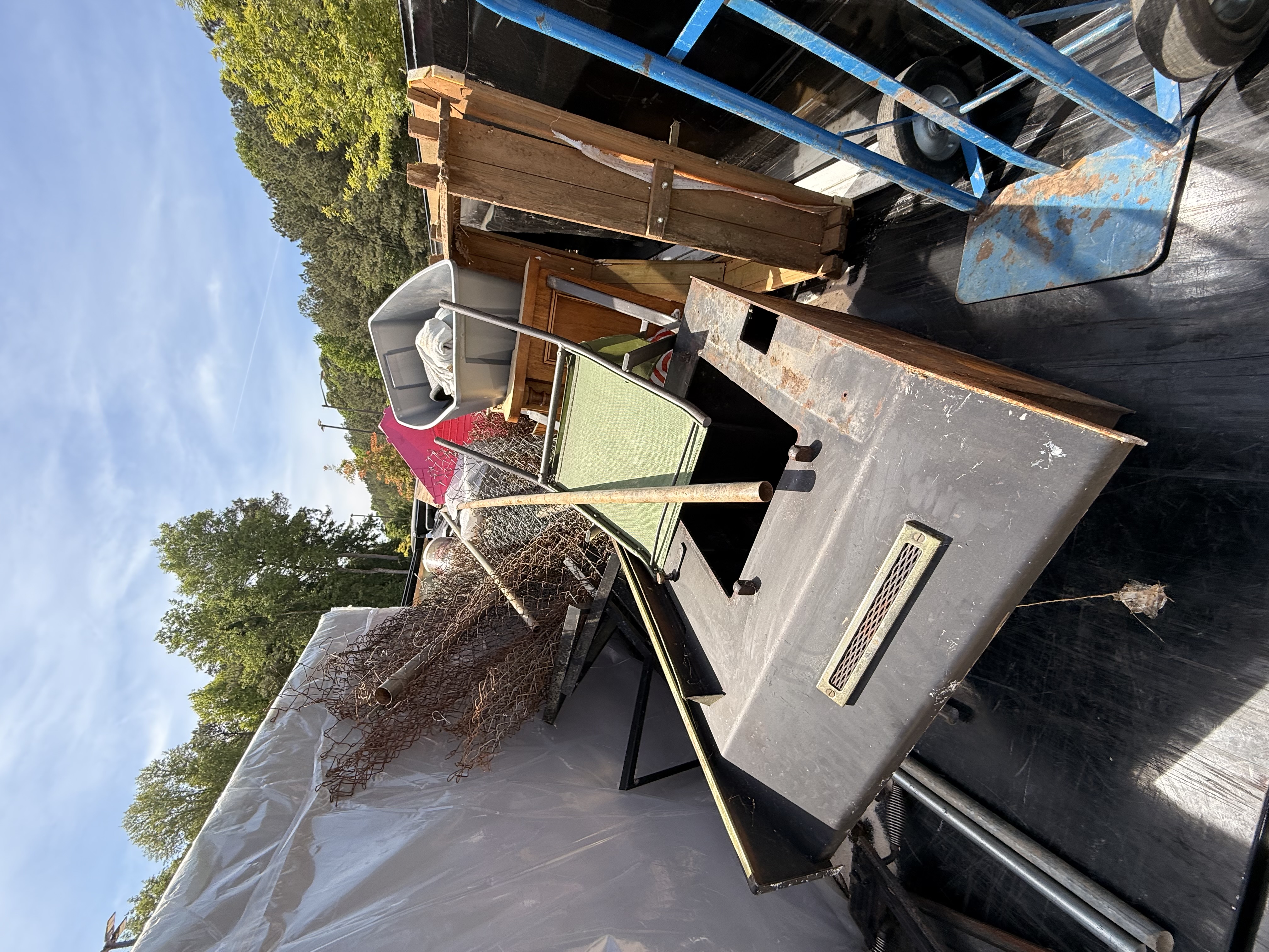 Mixed furniture and junk load on REZ trailer ready for haul