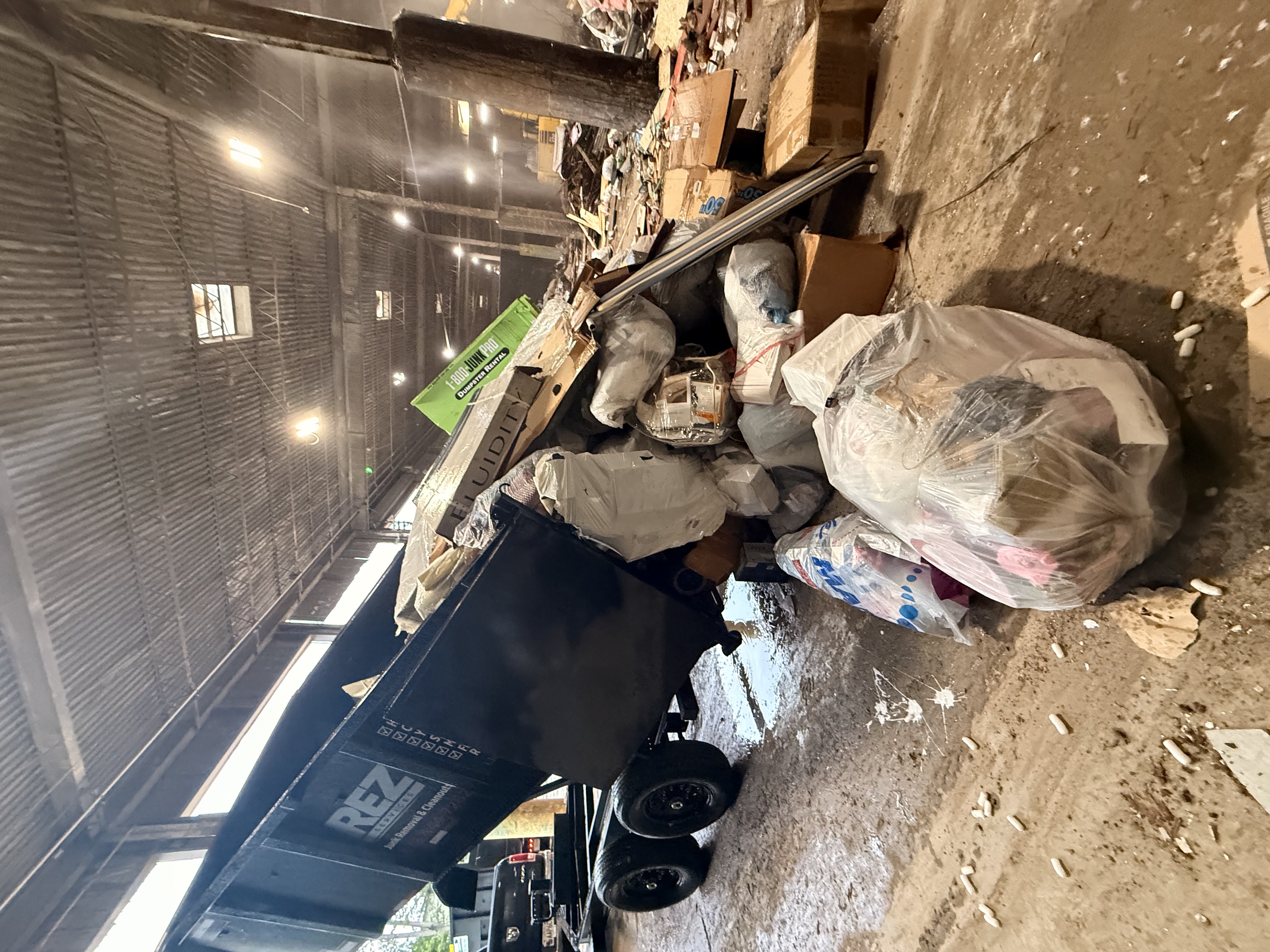 REZ Services trailer loaded with construction materials at a disposal facility