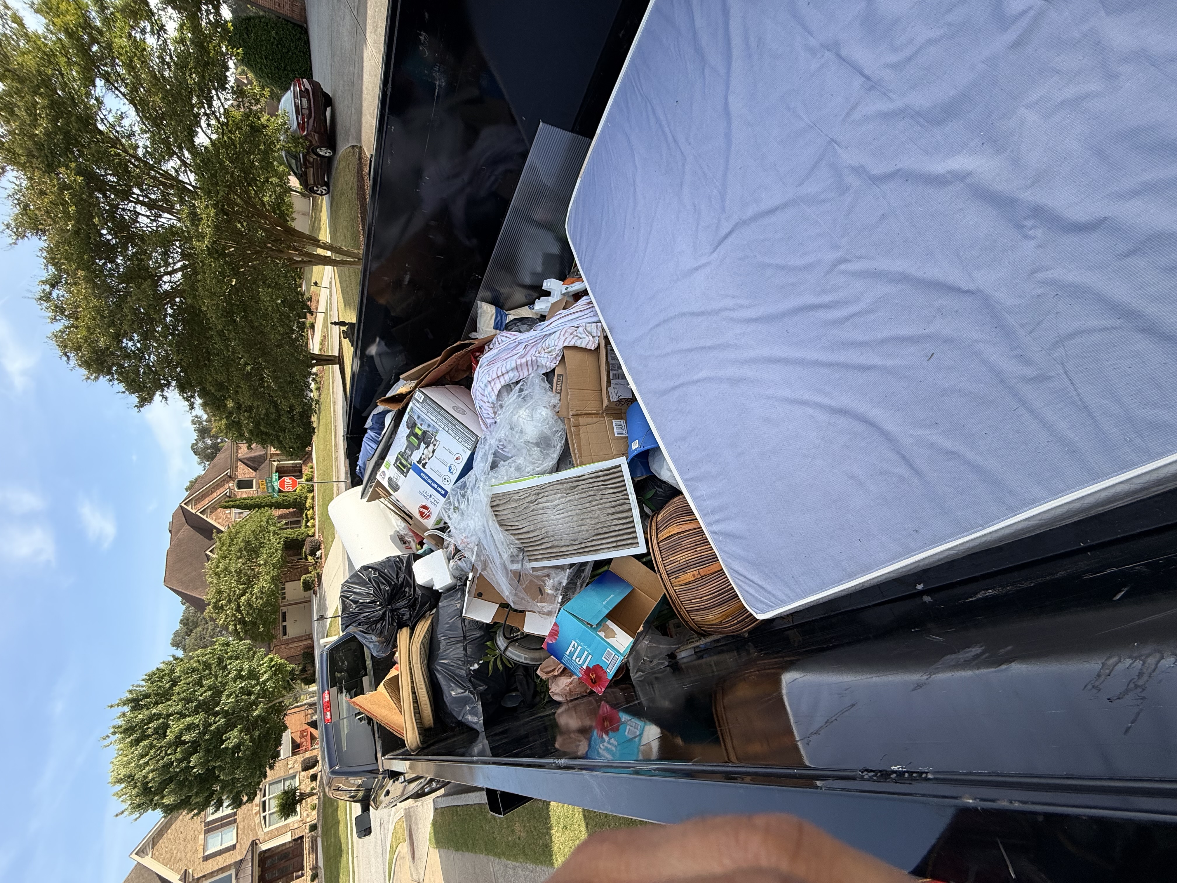 Full trailer load packed with household items and furniture