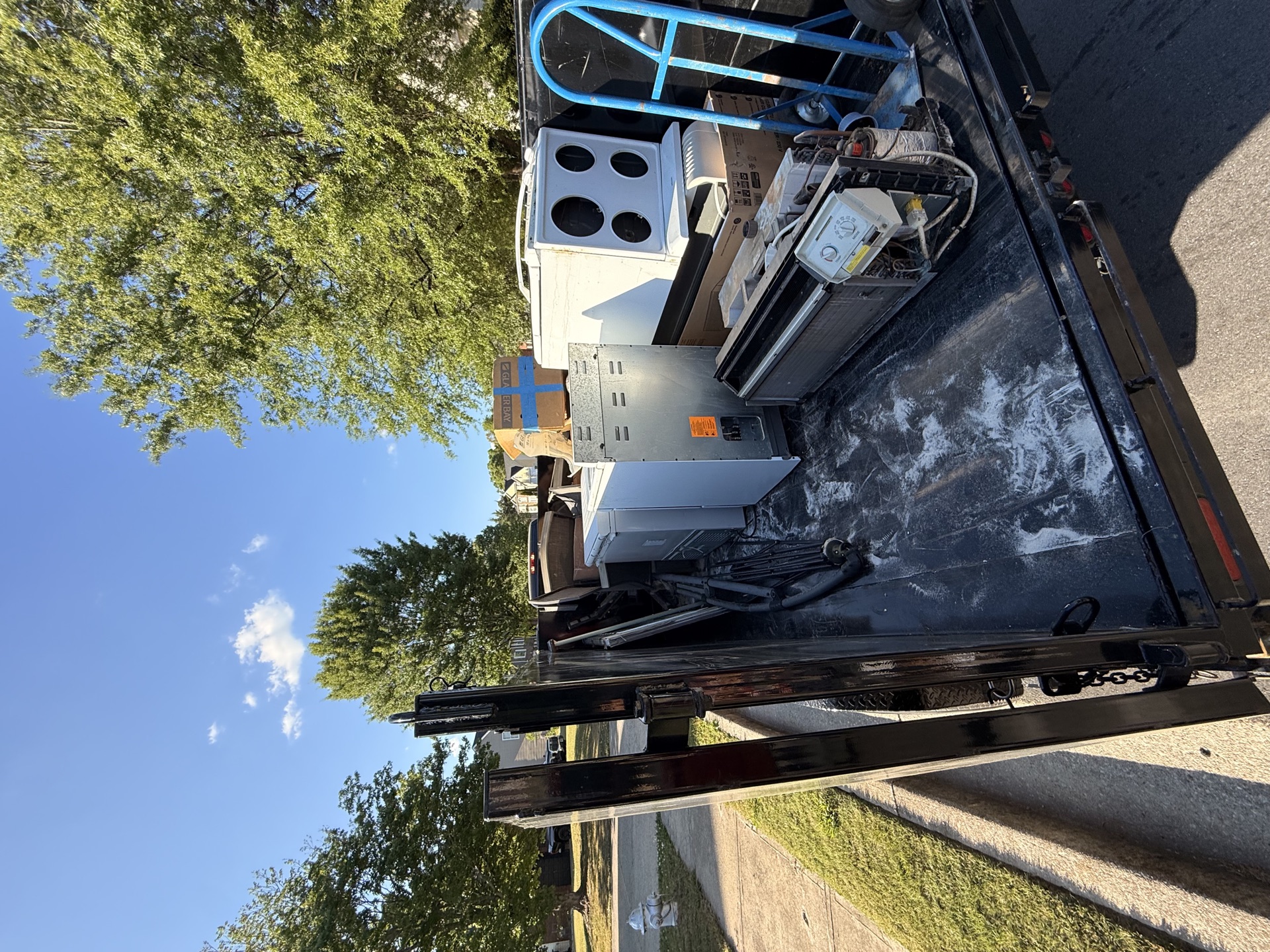 Appliances loaded on REZ Services trailer ready for removal